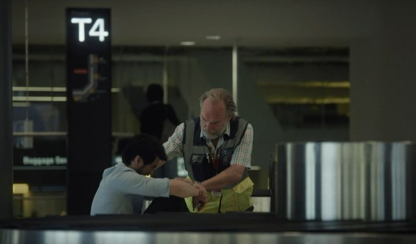 Hugo Weaving comforts a man in grief.