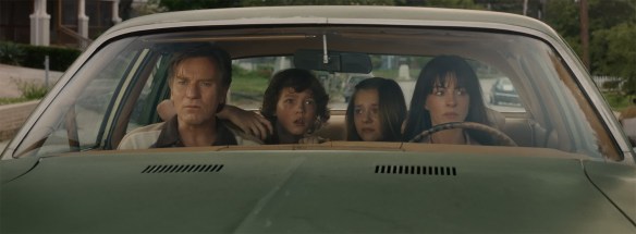 The family sit in a car wondering on what to do.