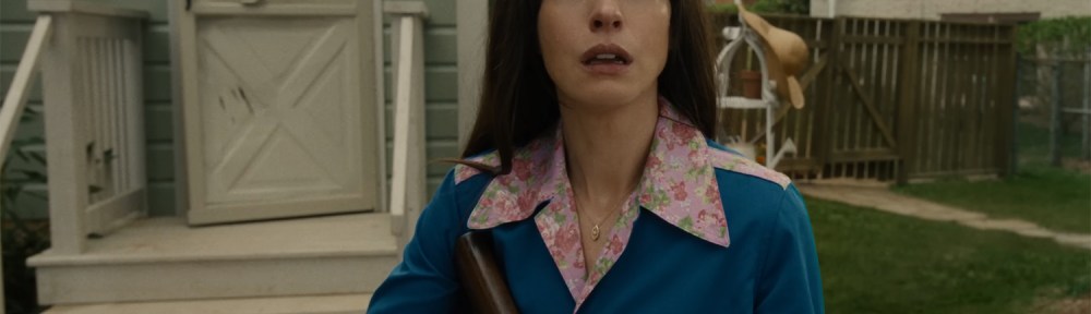 Denise with a gun.