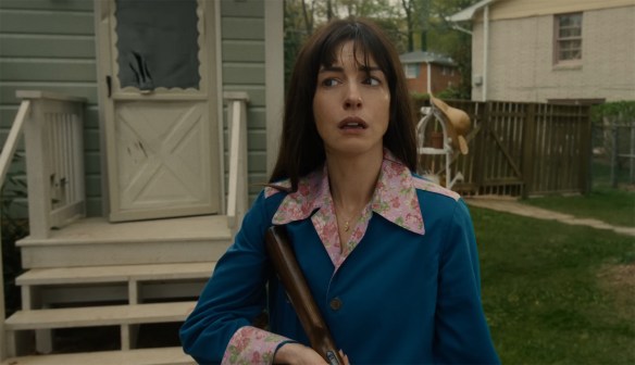 Denise with a gun.