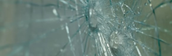 Water filling in the cracks of shattered glass. 