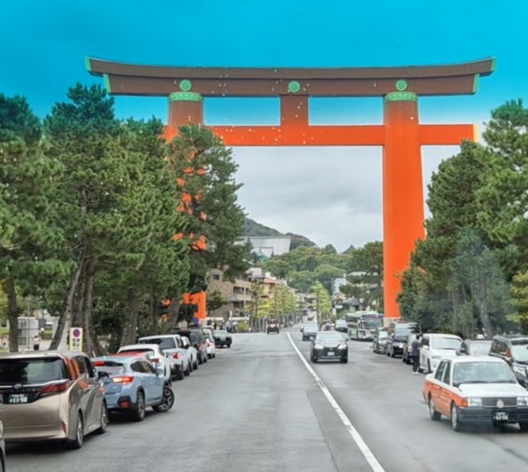 A large Tori gate over the road in Kyoto.