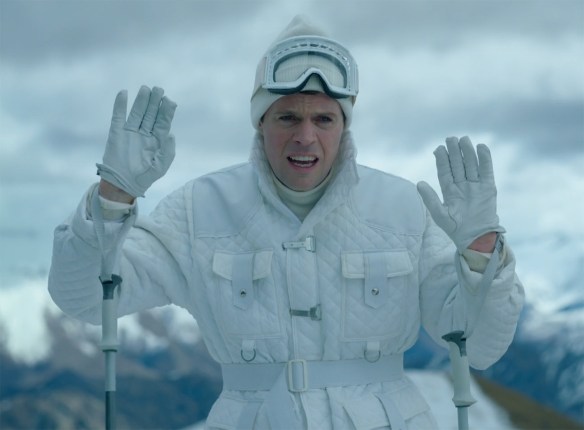 Paul Williams with his hands up in a sky outfit.
