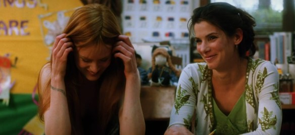 Sandra Bullock and Nicole Kidman laugh. 