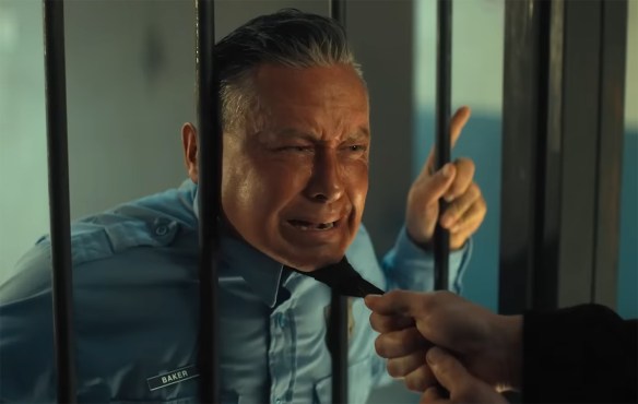 A dude gets his head crunched in-between prison cell bars.