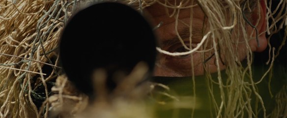 Tim Roth in a ghillie suit.