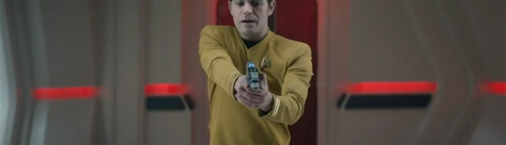 Kirk holding a phaser.