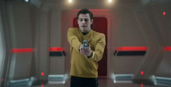 Kirk holding a phaser.