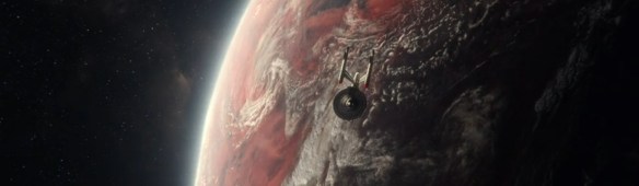 The USS Enterprise over a planet.