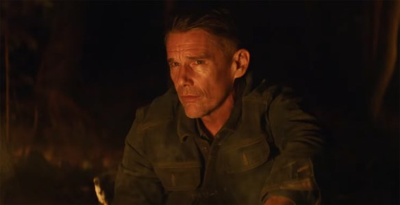 Ethan Hawke by a fire.