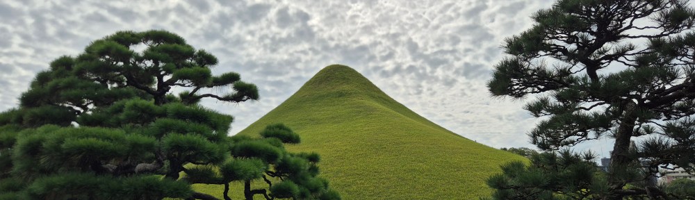 Clouds over the Mt. Fuji hill in Suizenji Park.