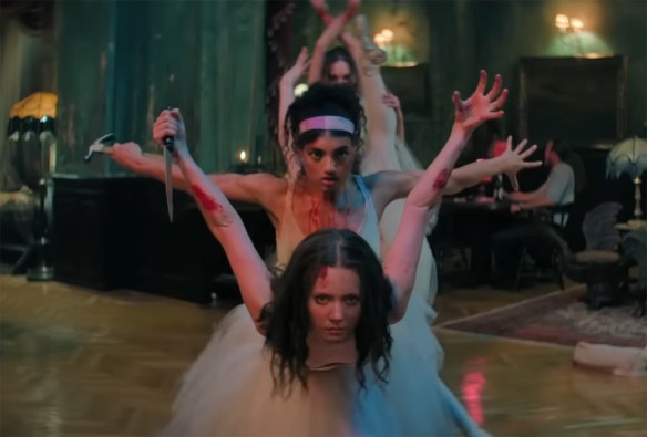 The ballerinas pose with weapons. 