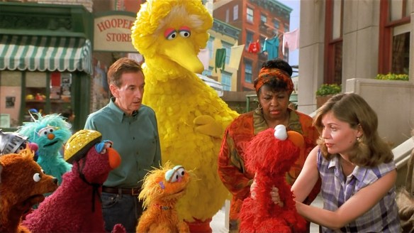 Everyone comforts Elmo.