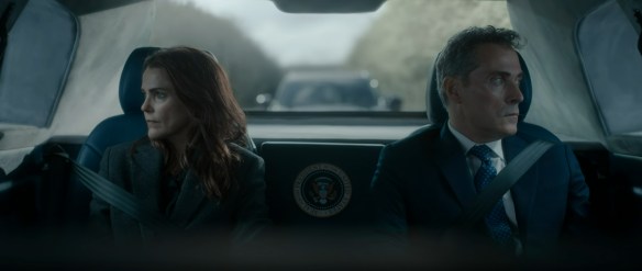 Hal and Grace look out different windows during a car trip.
