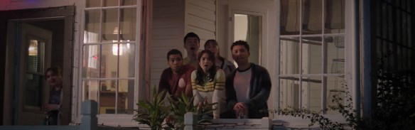 The gang looks in shock at a kiss.