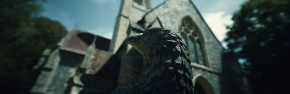 A statue of a bird in front of Jocasta's digital house. 