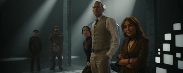 The gang in colour in a black and white room.