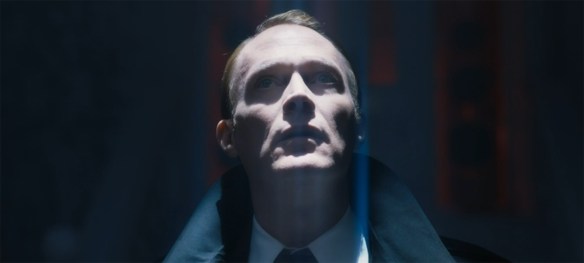 Vision looks up into a bright light.