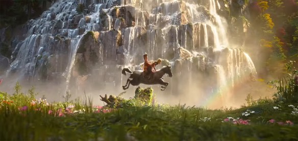 A horse jumps in front of a waterfall.